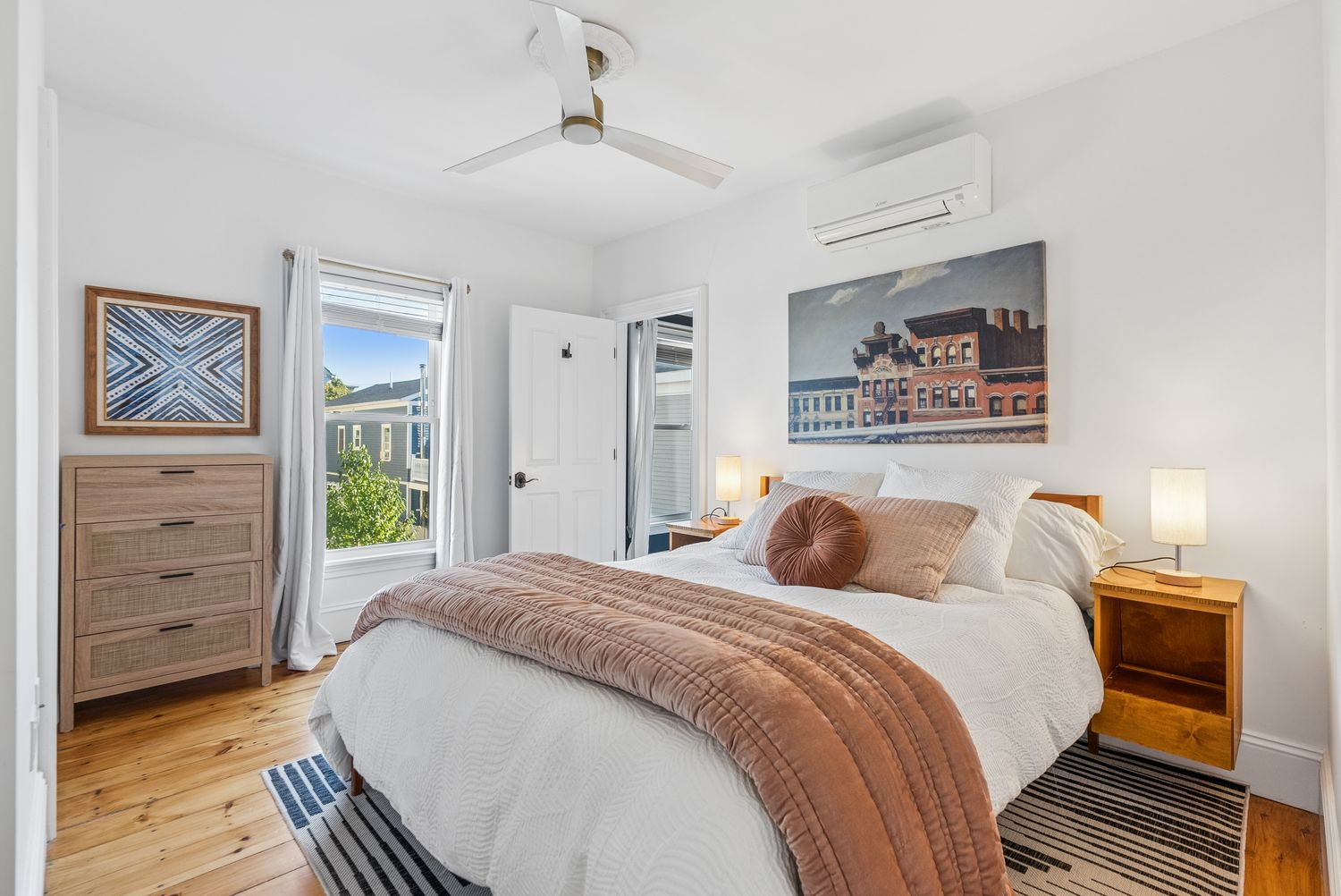 Bedroom with queen bed and corner windows, Residence One