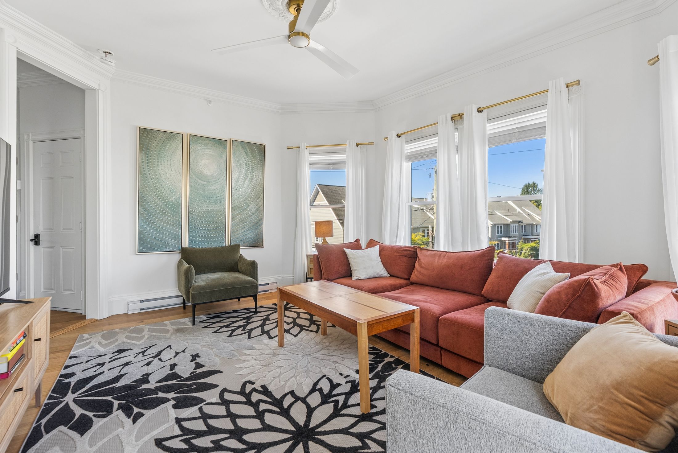 Living room with sectional seating, Residence Three
