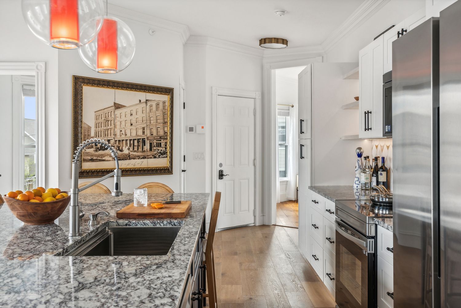 Kitchen with granite counters and full-size refrigerator, Residence Three