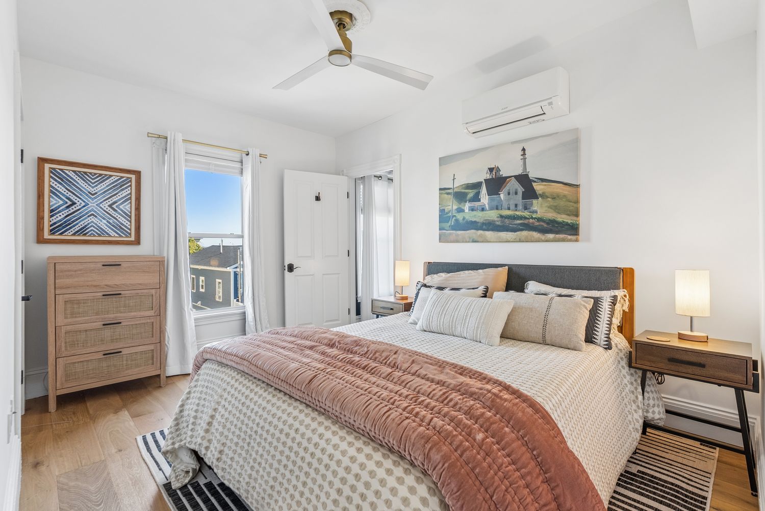Bedroom with queen bed and dresser, Residence Three